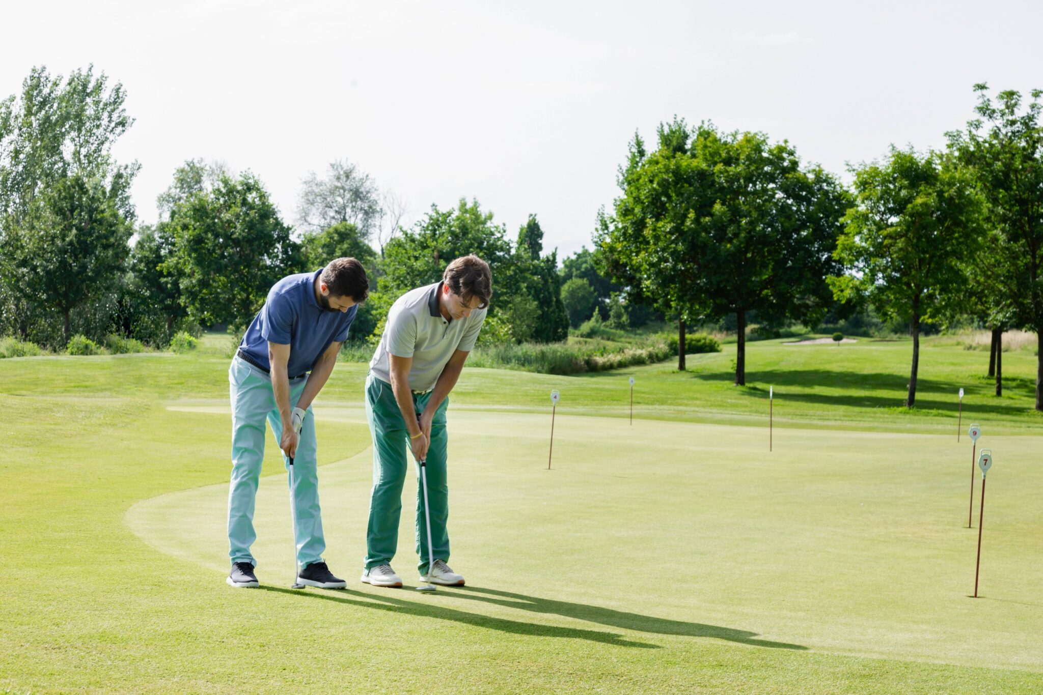 Golf coaching on a practice green, representative image