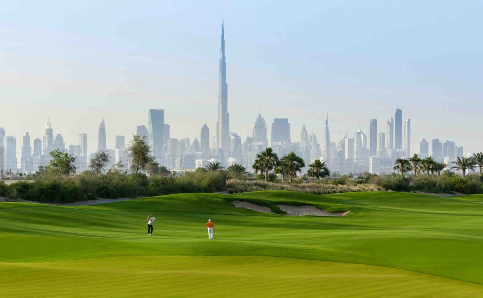 Dubai Hills Estate golf course with the Downtown Dubai skyline