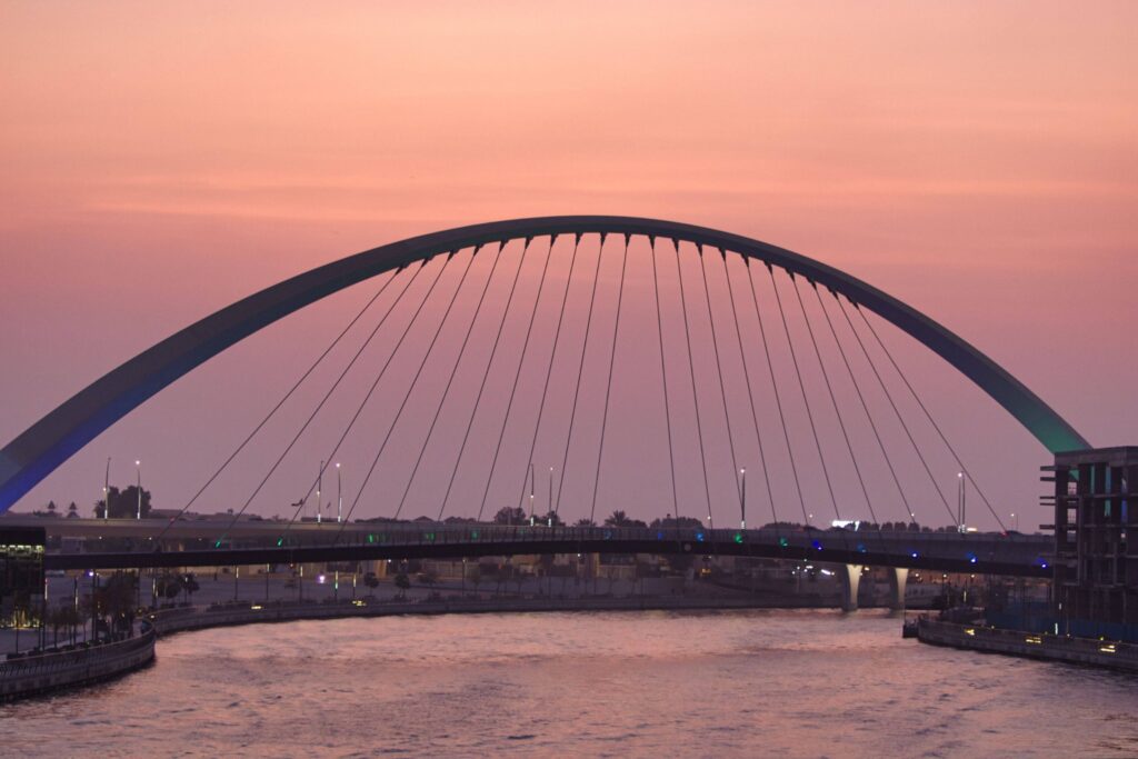 Dubai Water Canal pedestrian bridge at sunset