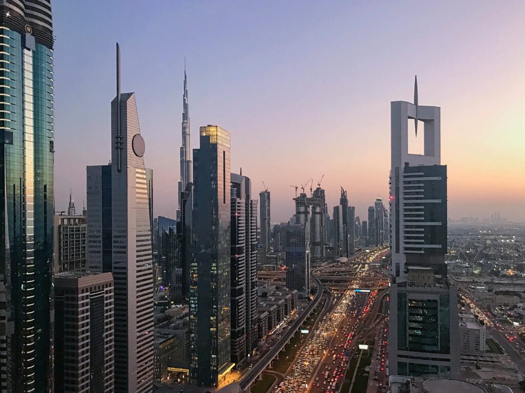 Sheikh Zayed Road towers and the Burj Khalifa at sunset