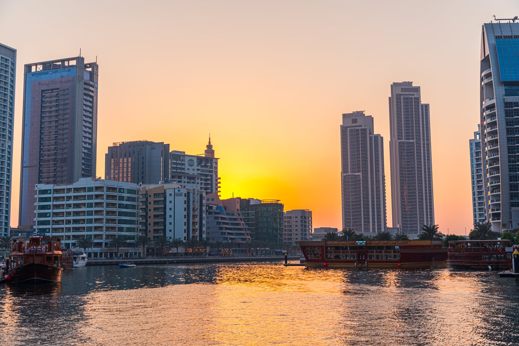 Dubai Marina residential towers and canal at sunset